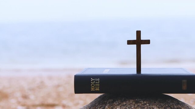 Background of a church summer retreat, summer Bible school, and summer camp featuring the sound of cool waves, the sea, a sandy beach, a Bible, and a cross.
