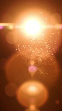 Warm golden light leaks with floating dust particles and soft bokeh lens flares for cinematic atmosphere