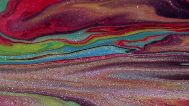 Gradient ink leak. Shimmering spill. Red green blue marble liquid defocused mixing. Bright art wet texture abstract blur background.