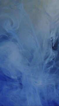 Vertical video. Cloud paint. Splash art. Defocused blue white color water chemical fluid smoke wet texture liquid hovering on abstract background.