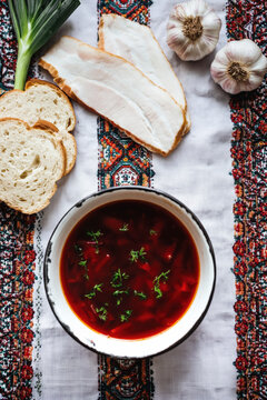 Traditional Ukrainian Borscht Soup with Bread and Fresh Ingredients. AI generative.