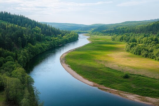 serene winding river meandering through lush green conifer forests and grassy floodplain under soft cloudy sky