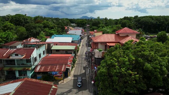 Atmospheric aerial shot of the Alfonso district in Barangay Poblacion III Alfonso Cavite Philippines showcasing a recognizable roadside business location within the town center.
