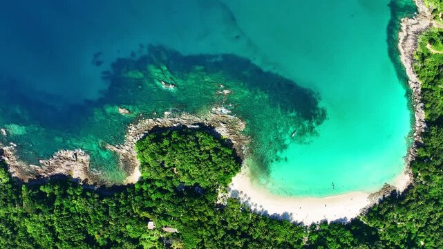 Aerial view Drone camera of seashore rocks in summer season, Beautiful freedom beach in Phuket Thailand, Amazing sea waves crashing on rocks seascape in Phuket island Thailand