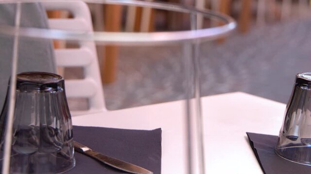 Outdoor Bistro Table Setting with Glassware and Napkin in Cassis