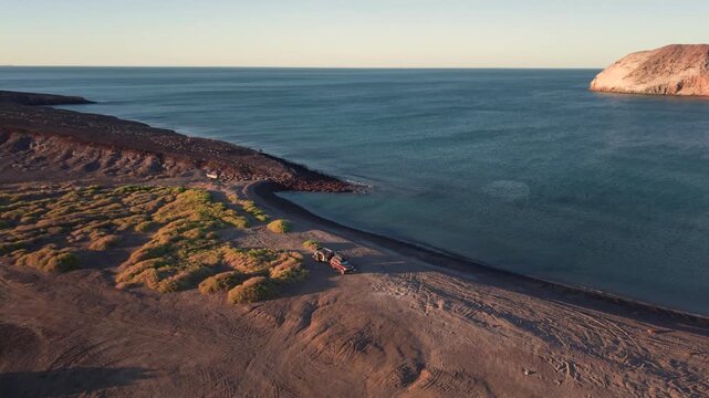 Enjoy camping on the beach as the sunset lights up the sky over Baja California Mexico. Experience the adventure of overland travel