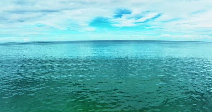 Beautiful Sea in summer season white clouds and blue sky footage from drone