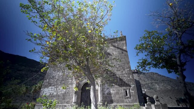 Discover the stunning San Javier Mission church near Loreto with views of mountains and an oasis in the desert landscape