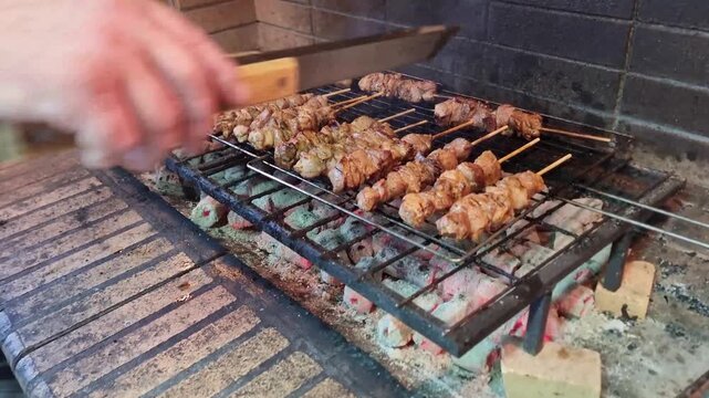 souvlakia meat preparing grilled on fire