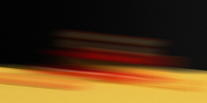 Abstract background dynamic motion blur with vibrant red and yellow streaks on black and yellow base.