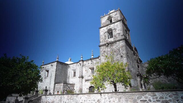 View the San Javier Mission church located near Loreto nestled between mountains and a desert oasis filled with greenery and history