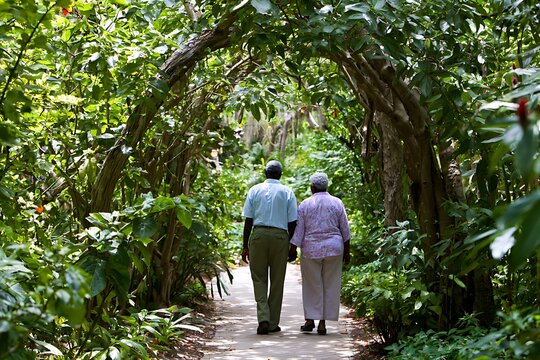 Senior couple walking through lush garden path