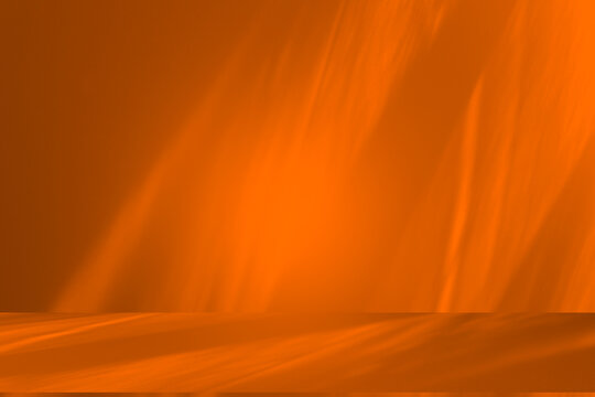 Wall interior background, studio and backdrops show products.with shadow from window color orange background for text insertion and presentation product	