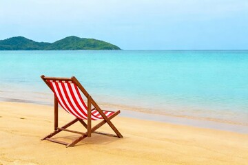 Fototapeta premium Beach Chair on Tropical Shore with Island View
