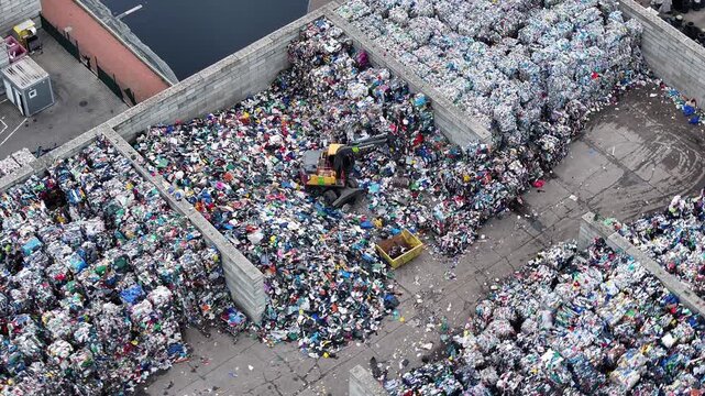 Recycling facility processes plastic waste near urban area