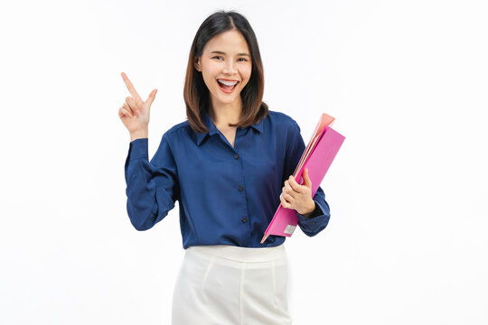 Happy young Asian businesswoman holding documents and pointing up on white background, business idea and presentation concept.