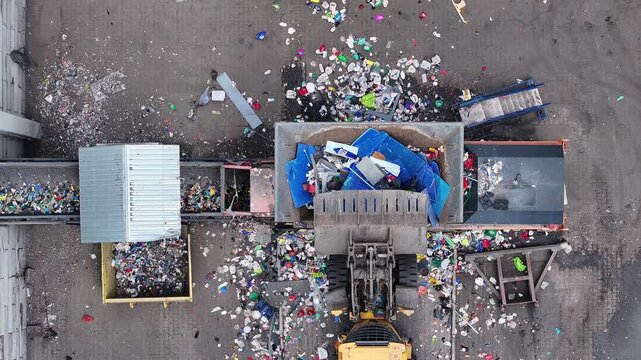 Operations at a waste recycling facility processing plastic waste