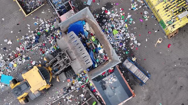 Plastic waste processing at recycling facility in operation