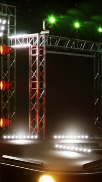 Bright lights shine on a stage prepared for a live performance. The structure includes metal frameworks with red and green lights. The setting is designed for entertainment events.