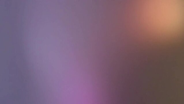 Abstract blurred background with soft gradient of purple, pink, brown, and orange hues, creating a dreamy and ethereal light leak effect.