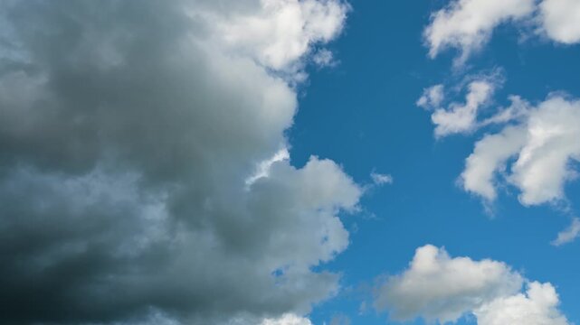 Timeless clouds move from a clear sky to a stormy sky. Timelapse Dynamic Sky Transition from Scattered Cumulus Clouds to Severe Dark Thunderstorm and Heavy Rainfall Over Landscape