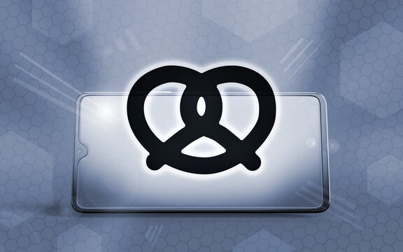 Smartphone 3D con un pretzel brillante sobre la pantalla, representando la cultura culinaria y la comida r&aacute;pida en dispositivos m&oacute;viles con un dise&ntilde;o moderno sobre fondo hexagonal tecnol&oacute;gico.