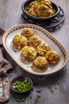 Delicious stuffed mushrooms with cheese and herbs served on a platter