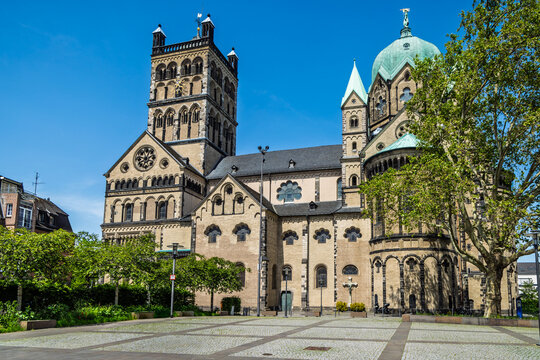 Basilica of St. Quirinus in Neuss Germany with a bustling market in front