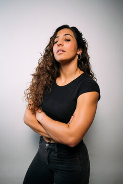 Confident young adult woman with strong attitude