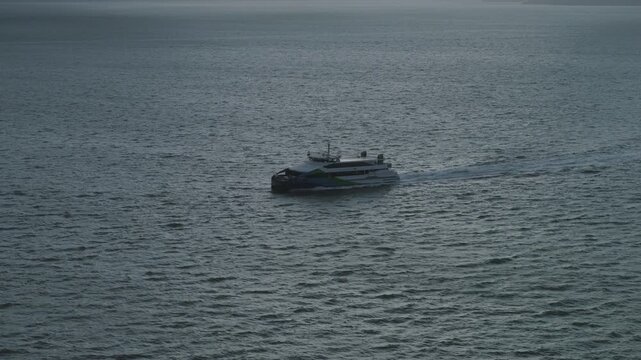 Passenger Ferry Catamaran Underway On Open San Francisco Bay - Aerial Shot At Dusk
