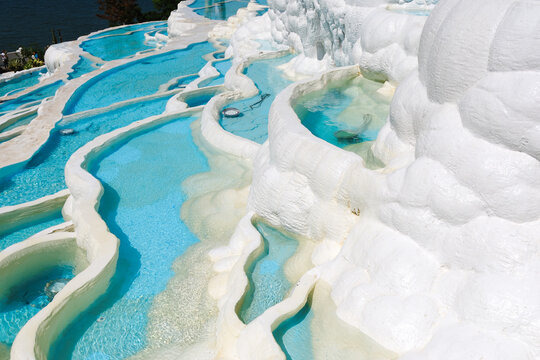 White travertine terraces with turquoise pools