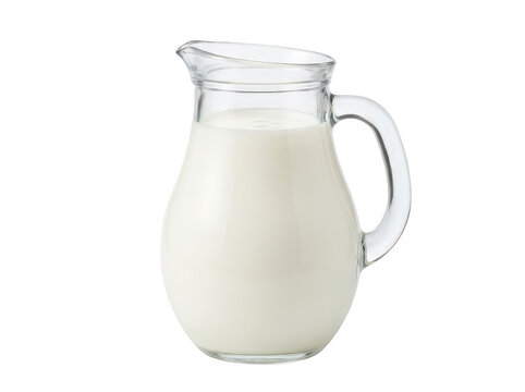 Clear glass pitcher full of fresh white milk
