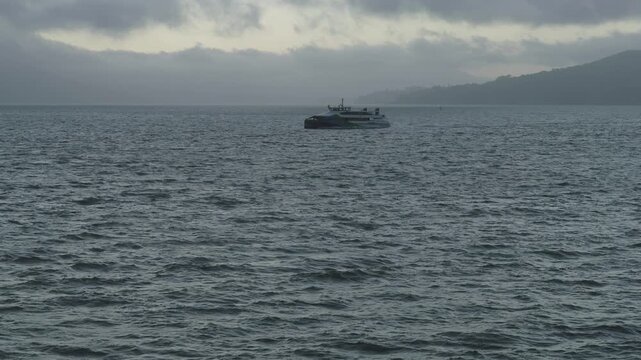 Passenger Ferry Crossing Choppy Bay Under Overcast Sky In San Francisco