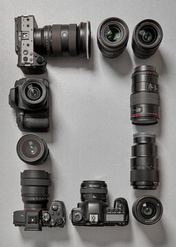 Professional cameras and lenses flat lay with copy space