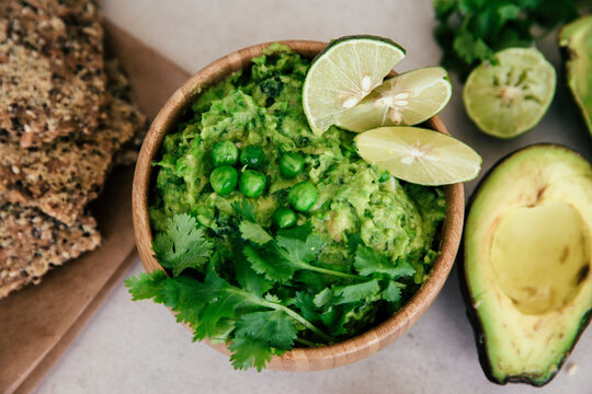 Guacomole with peas, avocado, lime, coriander and crisp bread