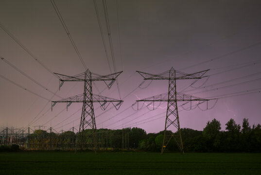 Power pylons and power lines during thunderstorm in the Netherlands