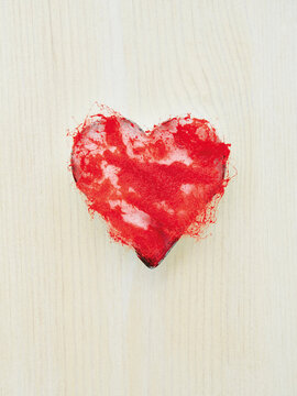 Cookie cutter filled with red dyed cotton wool