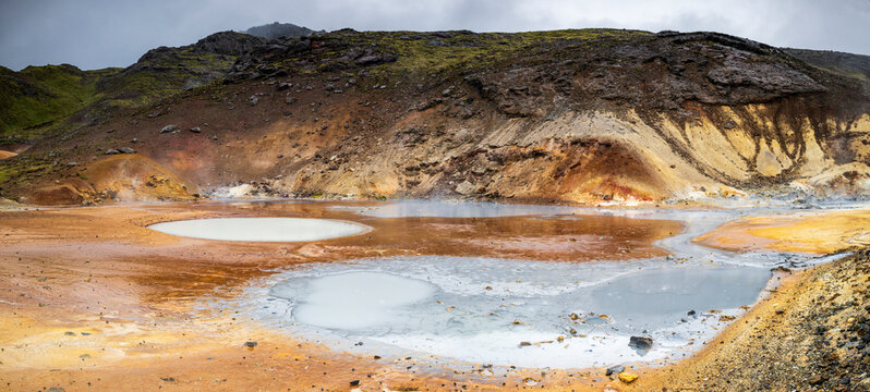 Steaming mud pools at Selt�n Geothermal Area in Iceland