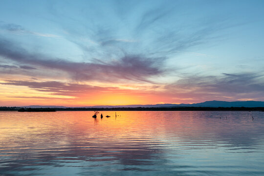 Valpara&iacute;so Reservoir with the sunset and its blue and orange colors, Zamora, Castilla y Le&oacute;n, Spain.