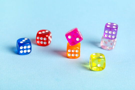 Colorful game dices on blue background