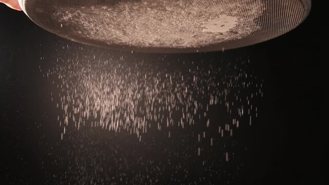 Flour Sifting Through Fine Mesh Sieve in Slow Motion for Baking Preparation