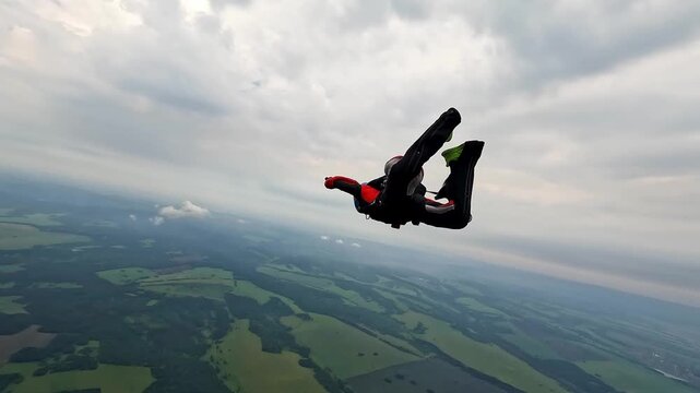 Skydiver in free fall at the moment of parachute opening
