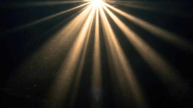 Sunburst Light Rays Through Dark Sky