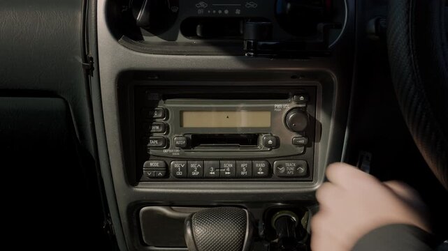 Inserting a Cassette Into the Retro Loved-In Vintage Car Audio System and Playing Good Old Music  |  Japan
