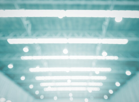 Glowing background illuminated warehouse industrial architecture interior light lights illumination blur roof defocused industry blurred glow bokeh building dark night factory abstract lighting
