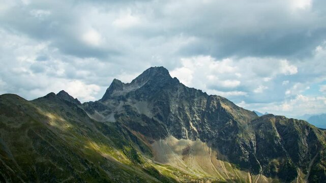 Aerial view of scenic alpine mountains in Tyrol Austria featuring rugged rocky peaks untouched wilderness and breathtaking travel landscapes in Europe