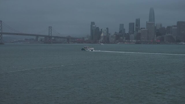 Passenger Ferry Crossing San Francisco Bay in Stormy Weather - Cinematic Aerial Shot