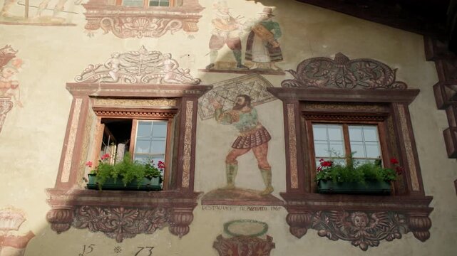 Urban landscape of the Tyrolean village of Umhausen in the Oetz Valley Austria. Beautiful architecture of historical buildings, travel and tourism in the mountains of Europe.