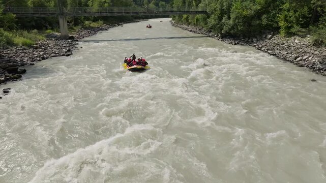 Active rafting sport on a wild mountain river in Otztal Austria featuring inflatable boat rapids outdoor adventure and recreation in the Alps