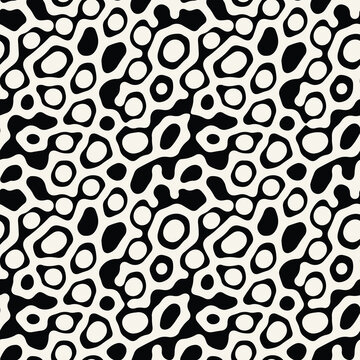 Vector seamless pattern. Abstract spotty texture. Natural monochrome design. Creative background with rounded spots. Decorative organic swatch.